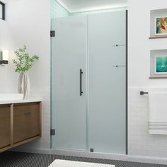 a bathroom with a sink, toilet and shower stall