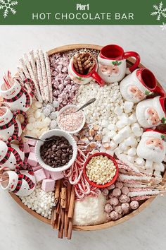 a platter filled with marshmallows, hot chocolate and other holiday treats