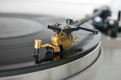 an old record player with its turntable spinning on it's side, close up