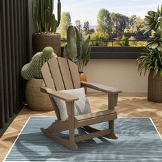 a rocking chair sitting on top of a wooden floor next to potted cacti