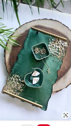 a green tray sitting on top of a tree stump