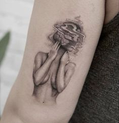 a woman's arm with a tattoo on it