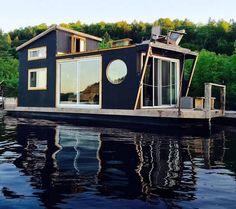 a houseboat floating on top of a body of water