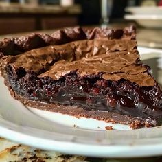 a piece of chocolate pie on a white plate