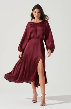 Love stories start here. This gorgeous satin-finish dress features a draped silhouette with long dolman sleeves, gathered front and cinched waist. Front slit accent punctuates a flowy and lined midi skirt. V-cut back. Concealed back zip closure. DETAILS + CARE  Dry Clean Only Self: 100% Polyester Lining: 100% Polyester Zipper Closure Style #ADR100916 Wedding Guest Dress Ideas, Solstice Party, Dolman Dress, Wedding Guest Outfit Fall, Winter Wedding Guest, Winter Wedding Guest Dress, Sukienki Plus Size, Winter Wedding Guests, Wedding Outfit Ideas