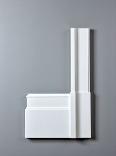 an open white door on a gray wall