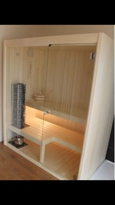 an empty sauna in the corner of a room