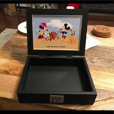 an open box with mickey mouse pictures on it