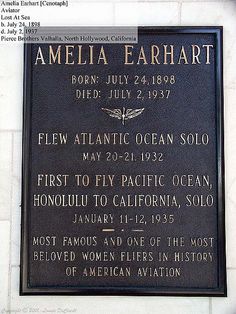 a plaque on the side of a building that reads, amelia earhart born july 24, 1876 died july 22, 1932