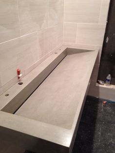 a white sink in a bathroom under construction