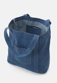 a denim tote bag with an open pocket