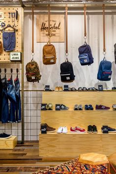 a store display with many different types of backpacks