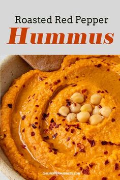 roasted red pepper hummus in a white bowl with text overlay that reads roasted red pepper hummus