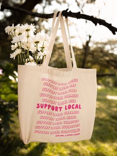 "Support Local Tote Bag by Chelzart Shop small and support dreams. This Support Local tote bag is the perfect accessory that you will want to show off! This 100% cotton bag comes in one size - 15\" x 16\"- perfect for everyday wear. The Support Local Business Tote Bag is durable and will last for years. The bag features 20\" handles (made from the same canvas), making it easy to carry even with a week's worth of shopping. ✦ Shop Small Accessory Details ✦  * 100% Cotton canvas * Made from spun fibers that make a very strong and durable fabric * The tote bag has self-fabric handles with reinforced stitching ✦ More Ways to Support, Shop, & Connect ✦ SHOP {Main Website} Chelzart.com WHOLESALE {Faire} Chelzart.faire.com/ CONNECT {Instagram & Facebook} @Chelzart SUPPORT {Monthly Art Club} Patreo Everyday Cotton Canvas Bag With Screen Print, Cotton Canvas Tote Bag With Screen Print, Screen Printed Canvas Tote Bag For Everyday Use, Screen Print Canvas Tote Bag For Everyday Use, Screen Print Canvas Tote For Everyday Use, Eco-friendly Canvas Bag With Screen Print For Everyday, Eco-friendly Everyday Canvas Bag With Screen Print, White Screen Print Bags For Everyday Use, Eco-friendly Canvas Bags With Screen Print