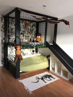 there is a bunk bed in the room with stuffed animals on it and stairs leading up