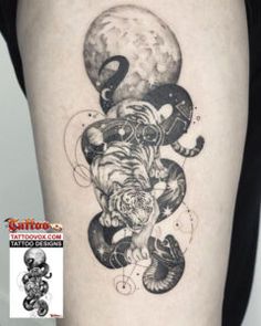 a woman's thigh with an octopus and tiger tattoo on the side of her leg