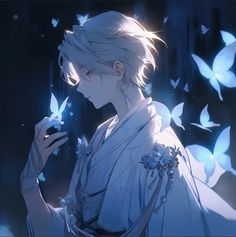 an anime character with white hair and blue eyes is holding a butterfly in his hand