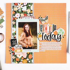 a scrapbook with scissors and papers on the table next to it is an image of a woman's face