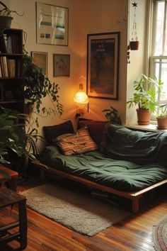 a living room filled with furniture and lots of plants on the windows sills