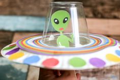 a paper plate with an alien on it