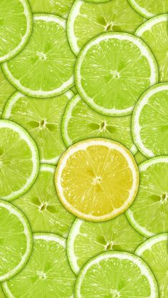 lime slices and oranges are arranged in rows on a green background with white highlights