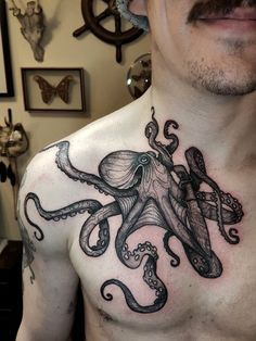 a man with an octopus tattoo on his chest