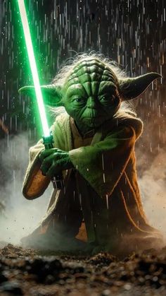 yoda in the rain holding a green light saber