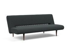 a gray couch with wooden legs and arms