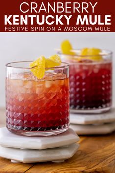 two glasses filled with cranberry kentucky mule