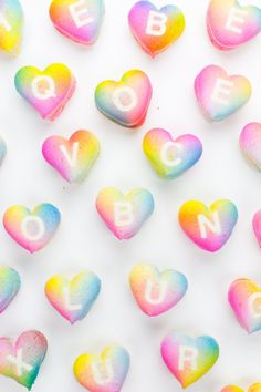 rainbow heart shaped candies with the word love spelled on them