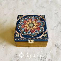 a decorative box sitting on top of a white surface