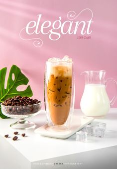 the cover of elegant magazine features an iced drink and coffee beans on a white table