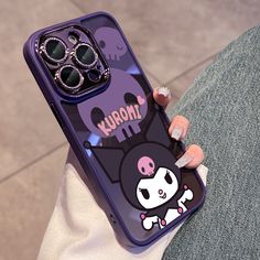 a person holding a cell phone case with an image of a cartoon character on it