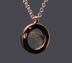 "This unisex human or pet hair locket is new to our collection of fill-at-home pieces. Your purchase includes the rose gold toned locket, gold toned chain, and does not require mailing the hair, ashes, flowers, sand, etc. It is composed of sturdy glass and rose gold toned stainless steel (hypoallergenic, scratch/tarnish resistant). The stainless steel chain is 32\" and can easily be worn shorter by threading the clasp through a different link. If screwed properly, the locket is air and watertigh Luxury Black Jewelry For Memorial, Hair Jewelry Dog, Cremation Jewelry Spirit Piece Memorials, Memorial Necklace Ring, Pet Ashes Keepsake, Luxury Spiritual Jewelry For Memorial, Hair Locket Keepsake, Hair Memorial Jewelry, Hair Locket