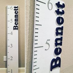 there is a ruler that has been placed on the wall next to a measuring tape