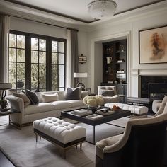 a living room filled with furniture and a fire place