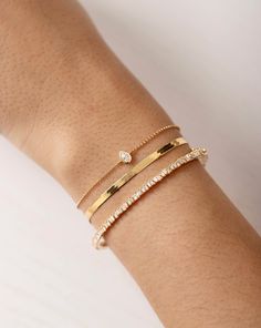 Why We Love It: Add a bit of edge to your stack with this unique bangle featuring offset baguette diamonds. The scattered angles of the setting ensure a luminous, light-catching statement. Dainty Bracelet Stack, Bracelets Stacked, Gold Bracelets Stacked, Unique Bangle, Diamond Bangles, Ring Concierge, Necklace Length Guide, Bracelet Size Chart, Kids Rings