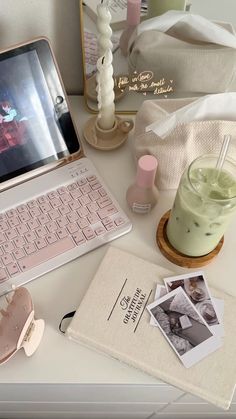 an open laptop computer sitting on top of a white desk