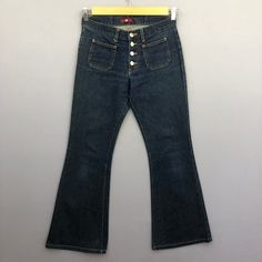 Vintage Japanese Bush Pants Button Fly Blue Wash Jeans Denim - GF30011.  Manual Measurement (laying in flat area):  1) Waist: 28 inch.  2) Rise: 9 inch.  3) Hips: 18 inch.  4) Tight: 10.5 inch.  5) Outseam: 37.5 inch.  6) Inseam: 29 inch.  7) Leg opening: 10 inch.  Fabric Material: 100% Denim Cotton.  Condition: In good vintage condition overall.  Please check all the measurement to insyre a proper fit.  Remember to allow yourself some extra room for movement.  You can compare these information Denim Bottoms With Buttons For Streetwear, Retro Mid-rise Jeans With Pockets, Mid-rise Cotton Flare Jeans With Button Closure, High Waist Cotton Jeans With Snap Buttons, Casual High Waist Flare Jeans With Buttons, Casual High-waist Flare Jeans With Buttons, Retro Flare Jeans For Streetwear, Retro Fall Jeans With Button Closure, Trendy High-rise Flare Jeans With Buttons