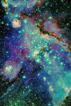 an image of some very pretty stars in the sky with blue, green and purple colors