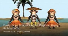 three monkeys are standing in the sand with an umbrella on their head and one is singing happy birthday to you