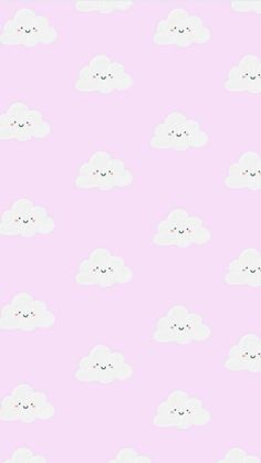 a pink wallpaper with white clouds and smiling faces on the bottom half of it