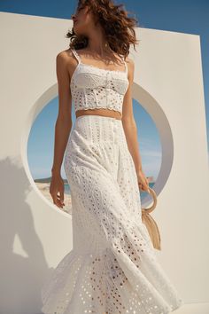 Theres an undeniable romance to the Gina skirt. Detailed with a row of dainty buttons through the front, leave a few unfastened to create a beautiful slit. Made from breezy broderie anglaise cotton-blend the Gina skirt flairs into a floaty asymmetric tier that sways gently with every step. Charo Ruiz Ibiza, Charo Ruiz, Eyelet Fabric, Summer Looks, Long Skirt, White Formal Dress, Ibiza, Beauty Women