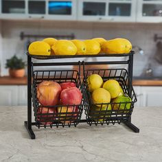 two baskets filled with fruit sitting on top of a counter