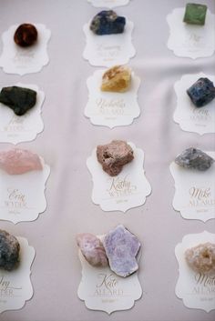 the rocks are all different colors and sizes on white paper with words written in them