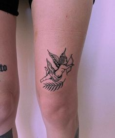 two people with tattoos on their legs