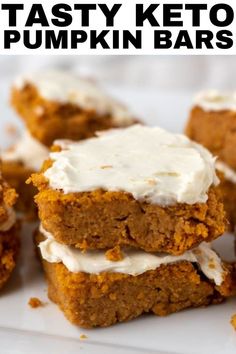 pumpkin bars with white frosting stacked on top of each other in front of the words, tasty keto pumpkin bars