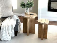 a living room scene with focus on the end table and two stools that have been made out of wood