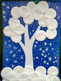 a paper plate tree with snowflakes on the branches and stars in the sky