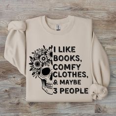 Get cozy this fall with our "I Like Books, Comfy Clothes, and Maybe 3 People" sweatshirt! Featuring a whimsical skeleton design, this cute and funny sweatshirt is perfect for book lovers who appreciate humor and comfort. Made from a soft and durable Unisex Heavy Blend™ Gildan 18000 crewneck (50% cotton, 50% polyester), it's great for lounging or showing off your love for reading. Whether for yourself or as a gift, this sweatshirt is a must-have for any bookworm! Cute Fall Sweater, Cute Sweaters For Fall, Skeleton Sweatshirt, Cute Skeleton, Funny Skeleton, Comfy Clothes, Fall Sweater